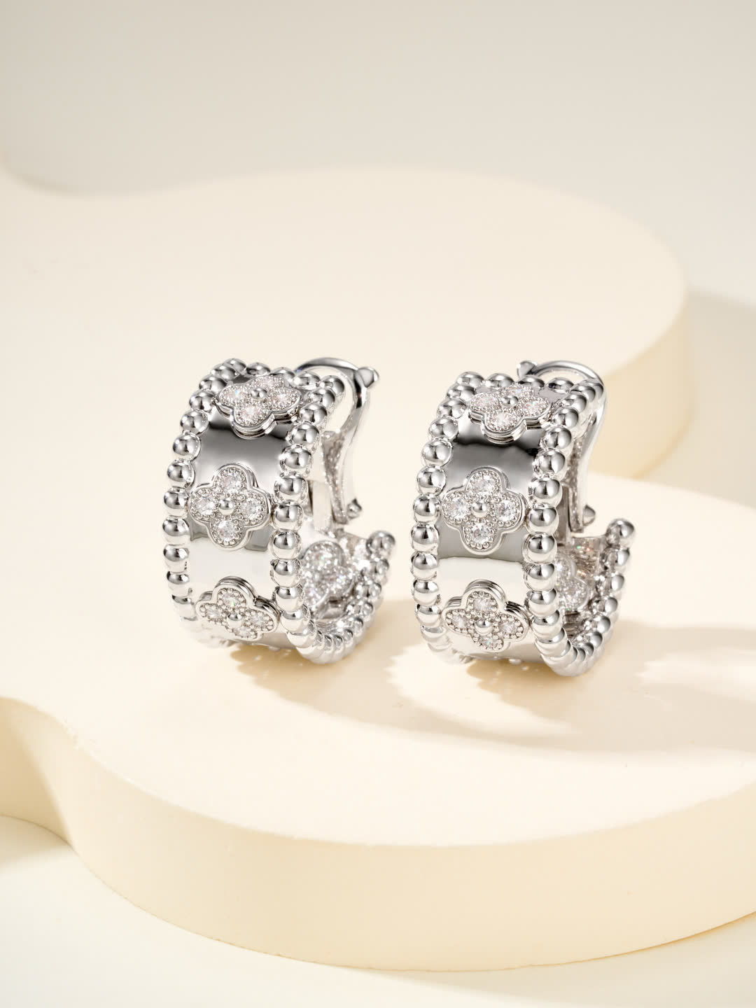 Van Cleef & Arpels Elegant Gold and Silver Hoop Earrings with Diamond Accents